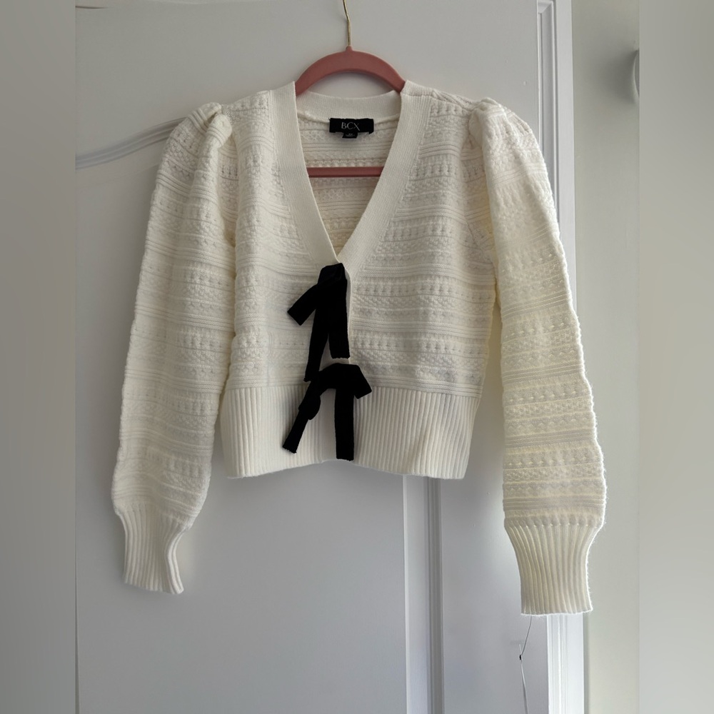 BCX Women's Ivory V-Neck Sweater with Black Bow Detail